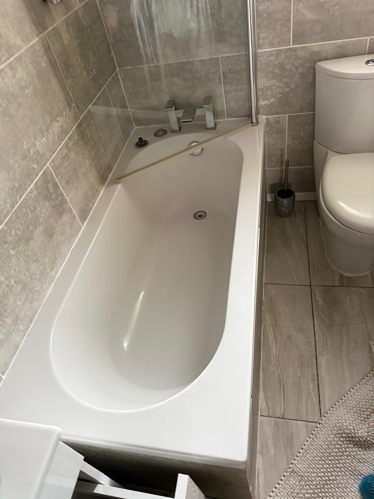 New bath with mixer taps and shower screen fitted by Semico Plumbers