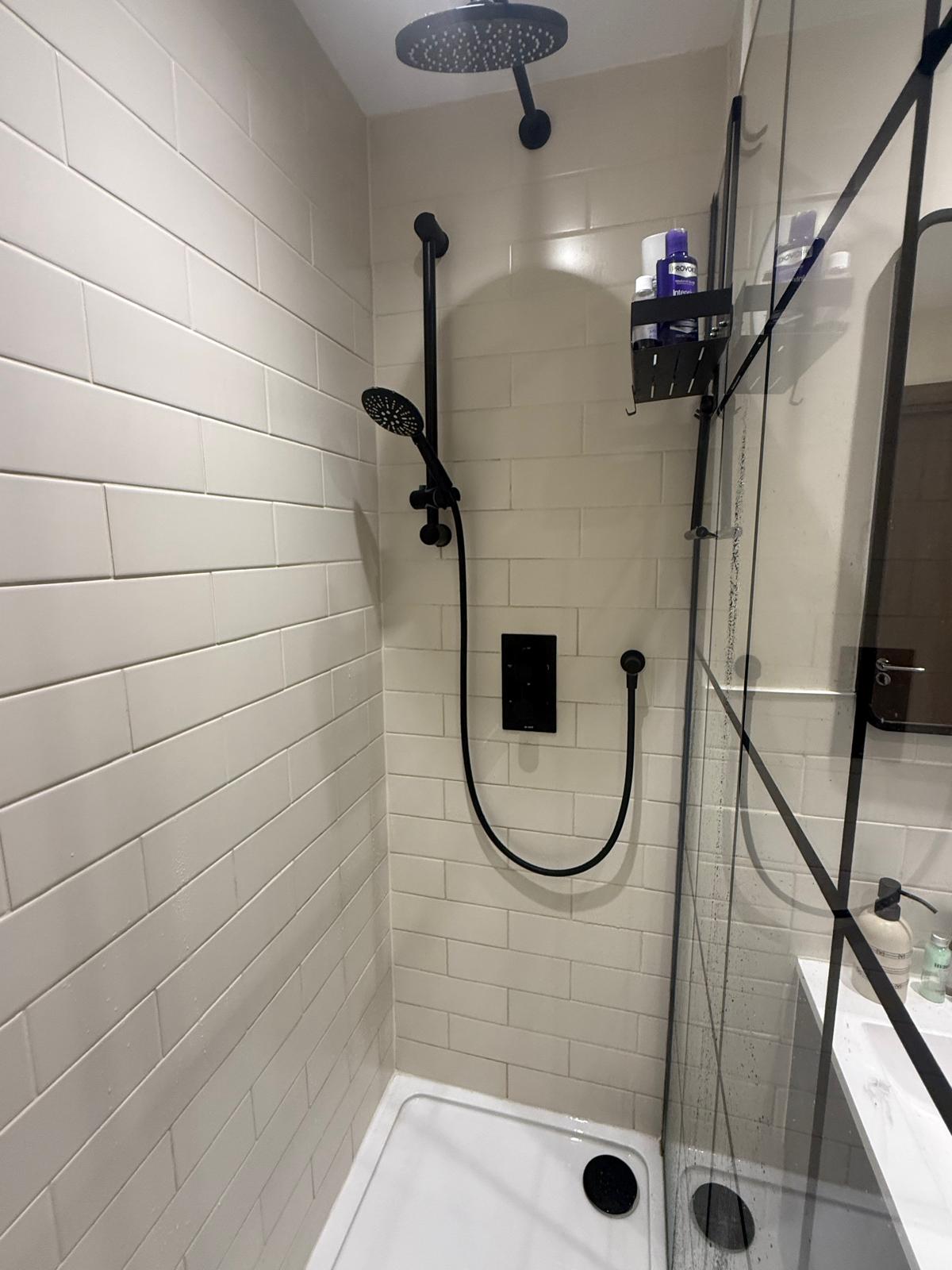 Matt black rainfall shower and glass screen installed by Semico Plumbers